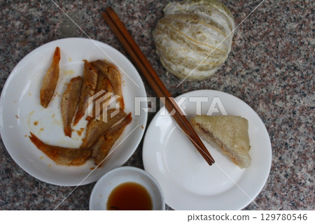 dried fish in basket and plate dried fish in basket and plate 129780546
