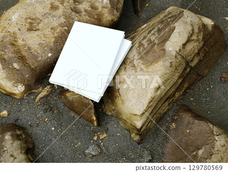Book mockup on stone with black sand background outdoor scene for design branding education storytelling creativity and natural concept Book mockup on stone with black sand background outdoor scene for design branding education storytelling creativity and natural concept 129780569