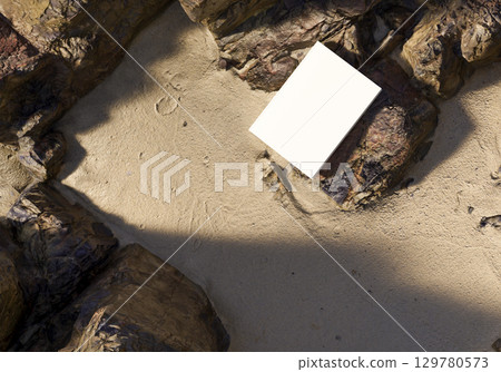 Book mockup on stone with golden sand background outdoor scene for design branding education storytelling creativity and natural concept Book mockup on stone with golden sand background outdoor scene for design branding education storytelling creativity and natural concept 129780573