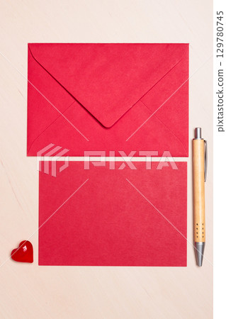 blank red paper and envelope on table 129780745