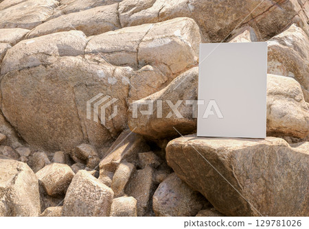 Standing book mockup on natural rock with background of large stones outdoor rustic scene for education publishing branding design stationery and creative presentation concepts 129781026