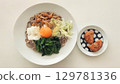 Healthy Japanese lunch of egg yolk soba noodles with nameko mushrooms and grated daikon radish 129781336