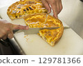 Cut the quiche 129781366