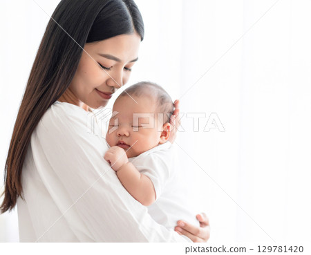 Young mother holding a baby, Generative AI, AI image 129781420