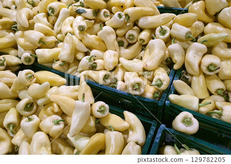 Yellow bell peppers in bulk at a market Yellow bell peppers in bulk at a market 129782205
