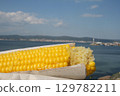 Fresh yellow corn cob with sea and sky backdrop 129782211