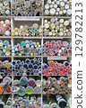 Various colorful buttons displayed on shelves in a store 129782213