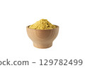 Savoury vegan yeast flakes in wooden bowl isolated on white background. 129782499