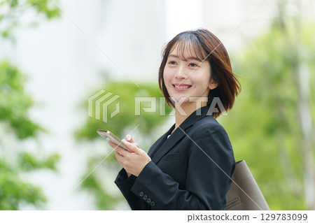 Young woman, business, outdoor, smartphone 129783099