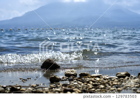 Pumice washed up on the shore Pumice washed up on the shore 129783503