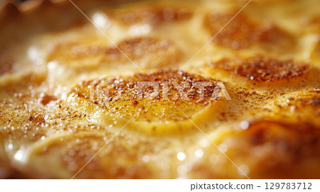 Close-up of homemade apple pie with a golden crust for Thanksgiving . 129783712
