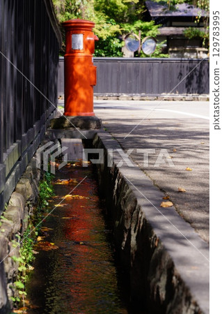 Scenery with a retro red postbox 129783995