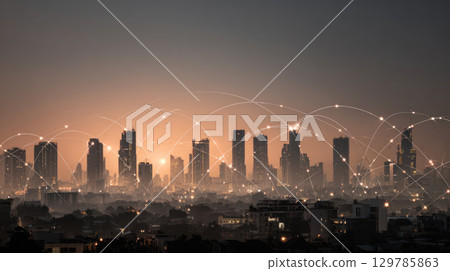 City skyline technology business connection network concept with illuminated buildings and digital communication lines at dusk 129785863