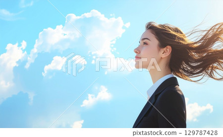 A young woman in a suit with a dignified expression against a blue sky. AI-generated illustration 129787428