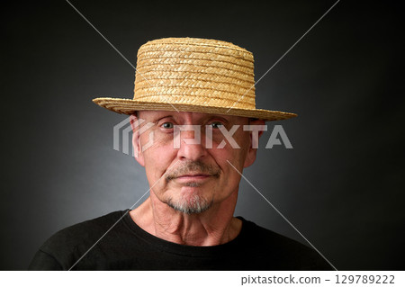 Portrait of a senior man in a vintage Harcourt style lighting Portrait of a senior man in a vintage Harcourt style lighting 129789222
