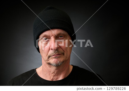 Portrait of a senior man in a vintage Harcourt style lighting Portrait of a senior man in a vintage Harcourt style lighting 129789226