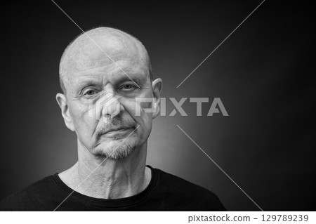 Monochrome Portrait of a senior man in a vintage Harcourt style lighting 129789239