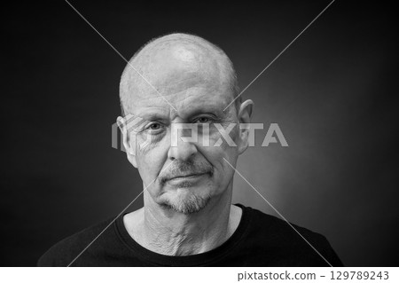 Monochrome Portrait of a senior man in a vintage Harcourt style lighting 129789243