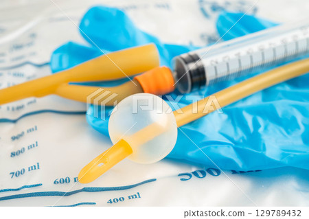 Foley catheter and urine drainage bag collect urine for disability or patient in hospital. 129789432