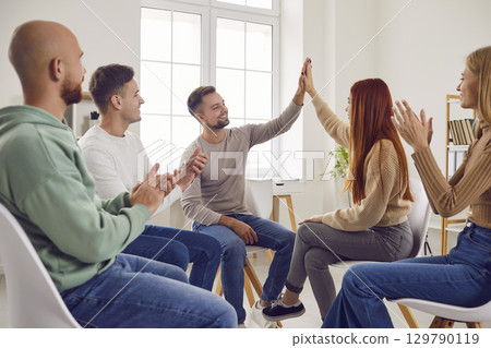 Helping people high five support, friends in community celebration or greeting activity 129790119