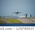 An ANA plane taking off from Haneda Airport and a waiting JAL plane 129790915