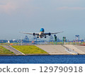 A blue aircraft just after taking off from Haneda Airport 129790918