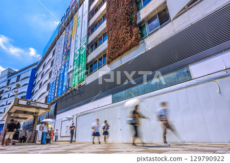 Tokyo cityscape, Japan, August 19. Overlooking the east exit of Ikebukuro Station. Renovation work on the Seibu Ikebukuro Main Store. 129790922