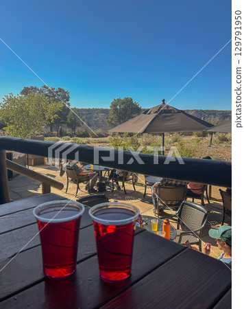 Two red drinks on patio table in Grand Canyon National Park 129791950