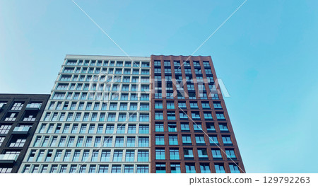 Architecture and real estate, modern residential apartment building with large panoramic windows Architecture and real estate, modern residential apartment building with large panoramic windows 129792263