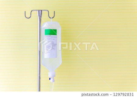 Saline solution fluid iv bag in emergency room at hospital. 129792831