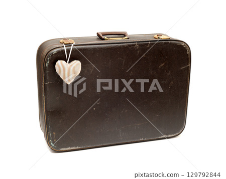 Vintage red suitcase isolated 129792844