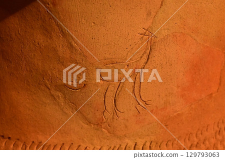 Animal designs carved into pottery Animal designs carved into pottery 129793063