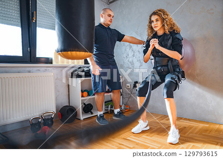 Dynamic fitness training with resistance and coaching Dynamic fitness training with resistance and coaching 129793615