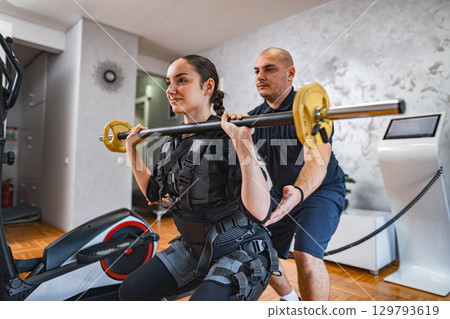 Empowered workout session with support and strength training 129793619