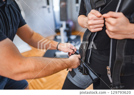 Electro muscle workout in a fitness studio 129793620