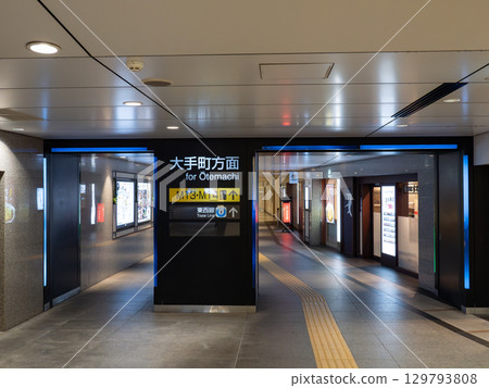 Underground passage and guide signs at the Marunouchi exit of JR Tokyo Station 129793808
