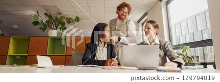 Engaging Collaborative Team Meeting Taking Place in a Modern and Inspiring Office Space 129794019