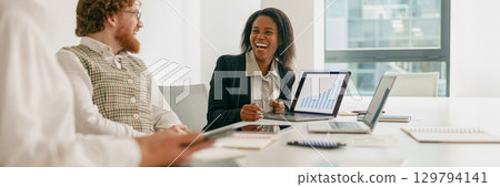 A Collaborative Business Meeting Held in a Modern Office Environment with Professionals 129794141