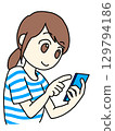 Woman operating a smartphone 129794186