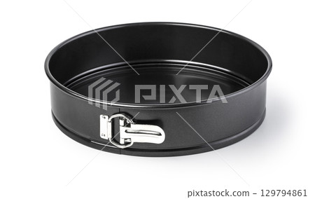 Round baking pan with removable bottom sitting on white background 129794861