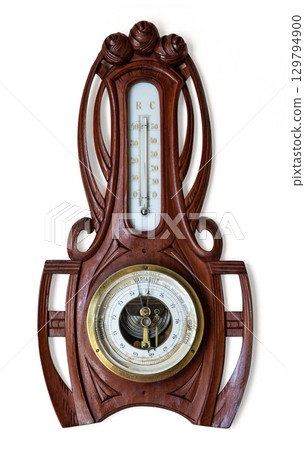 Antique wooden barometer and thermometer showing atmospheric pressure and temperature Antique wooden barometer and thermometer showing atmospheric pressure and temperature 129794900