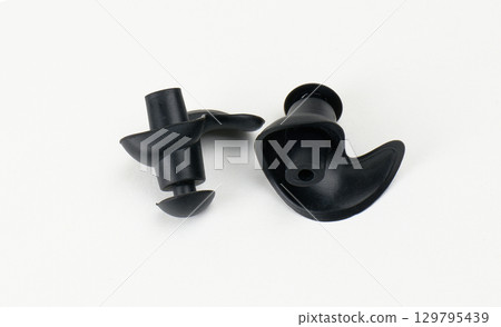 black pair of swimming ear plugs isolated. High quality photo 129795439