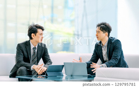 Two male businessmen having a meeting Two male businessmen having a meeting 129795781