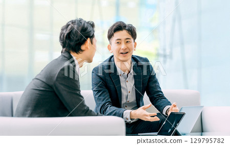 Two male businessmen having a meeting Two male businessmen having a meeting 129795782