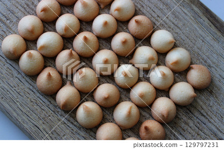 Stock Photo Of Wooden Bakery Board With Rows Of Small Round Egg Biscuit Cookies. Concept Photo For Bakery Shop Or Backgrounds  129797231