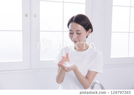Beauty image: A woman washing her face Beauty image: A woman washing her face 129797265