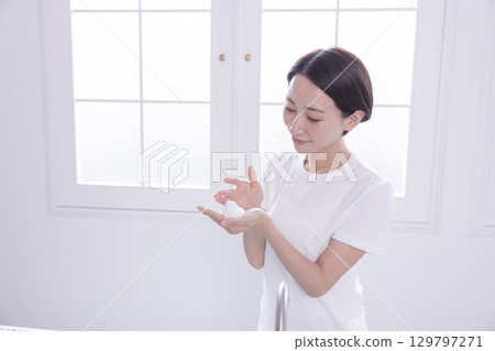 Beauty image: A woman washing her face Beauty image: A woman washing her face 129797271