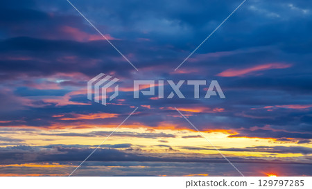 Beautiful sunset over the vibrant Icelandic sky with colorful clouds reflecting the light Beautiful sunset over the vibrant Icelandic sky with colorful clouds reflecting the light 129797285