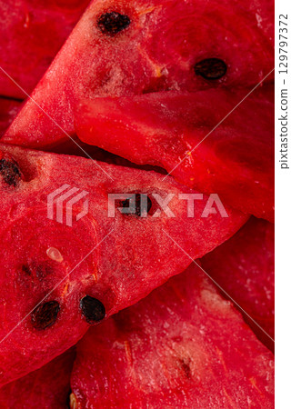 Fresh juicy sliced watermelon close up Fresh juicy sliced watermelon close up 129797372
