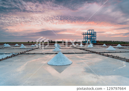 Sunset Over Qigu Salt Fields with Cloud-Covered Sun, Tainan City. 129797664